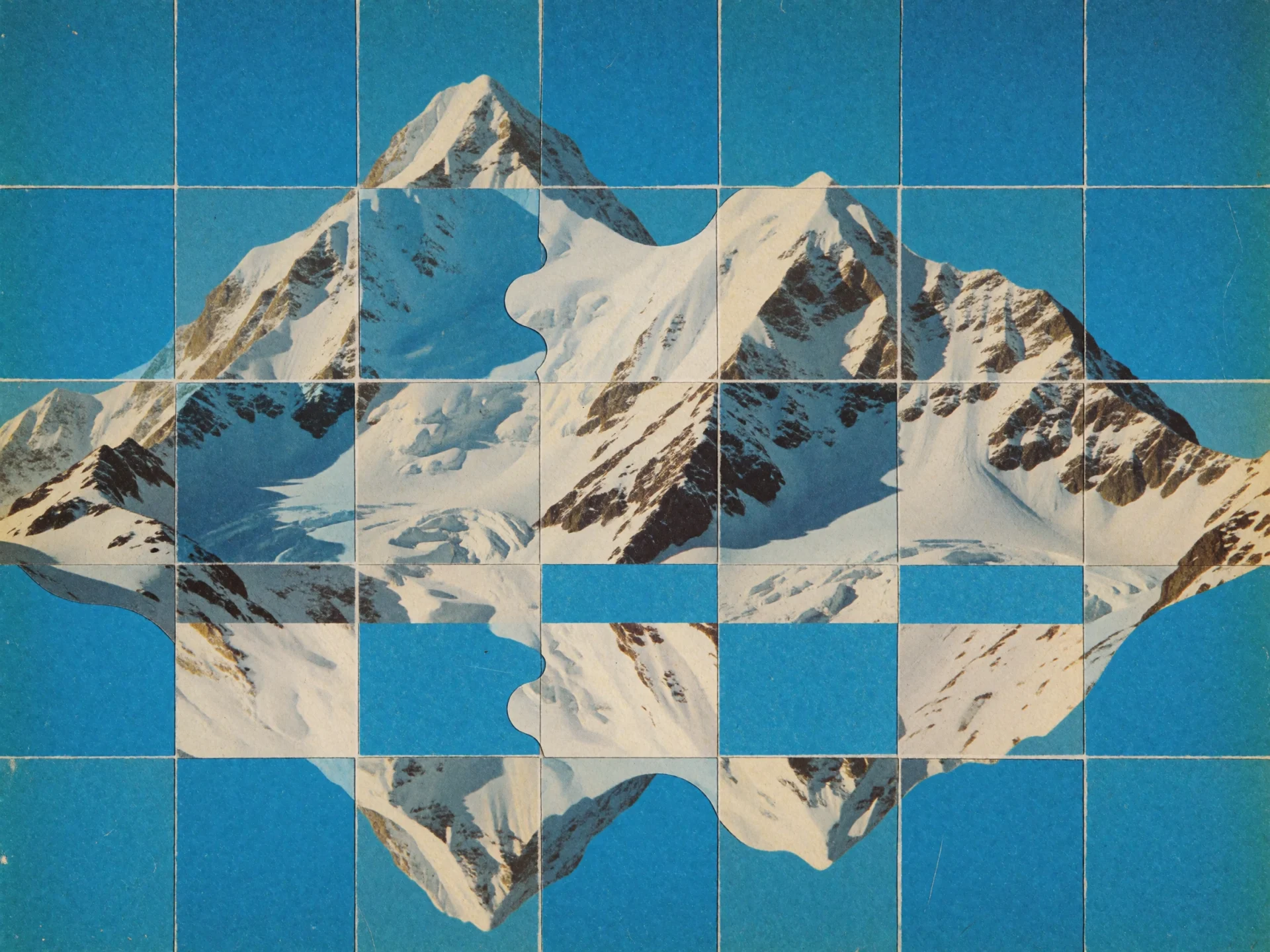 A snowy mountain range cut into a grid of tiles that alternate with solid azure squares.