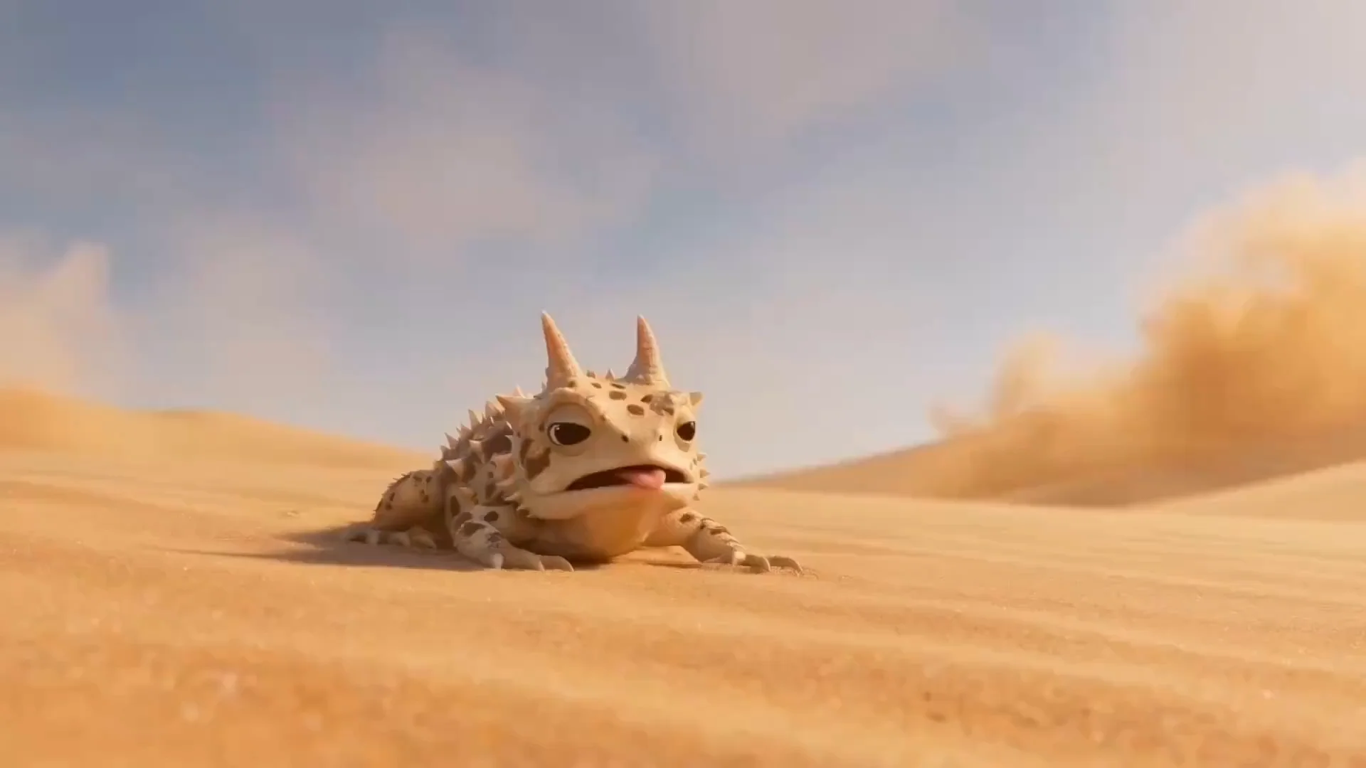 A horned lizard hugs a giant grapefruit on a sunlit desert dune.